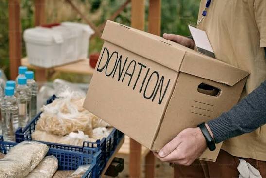 Staff logging a donation at the office