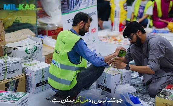Young volunteers packing school supplies for orphan students